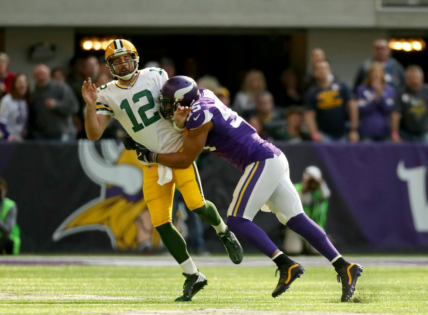 Green Bay Packers quarterback Aaron Rodgers (12) left the game after a hit on this play by Minnesota Vikings outside linebacker Anthony Barr (55) in the first quarter on Sunday, Oct. 15, 2017 at U.S. Bank Stadium in Minneapolis, Minn. (Jeff Wheeler/Minneapolis Star Tribune/TNS) ORG XMIT: 1213353