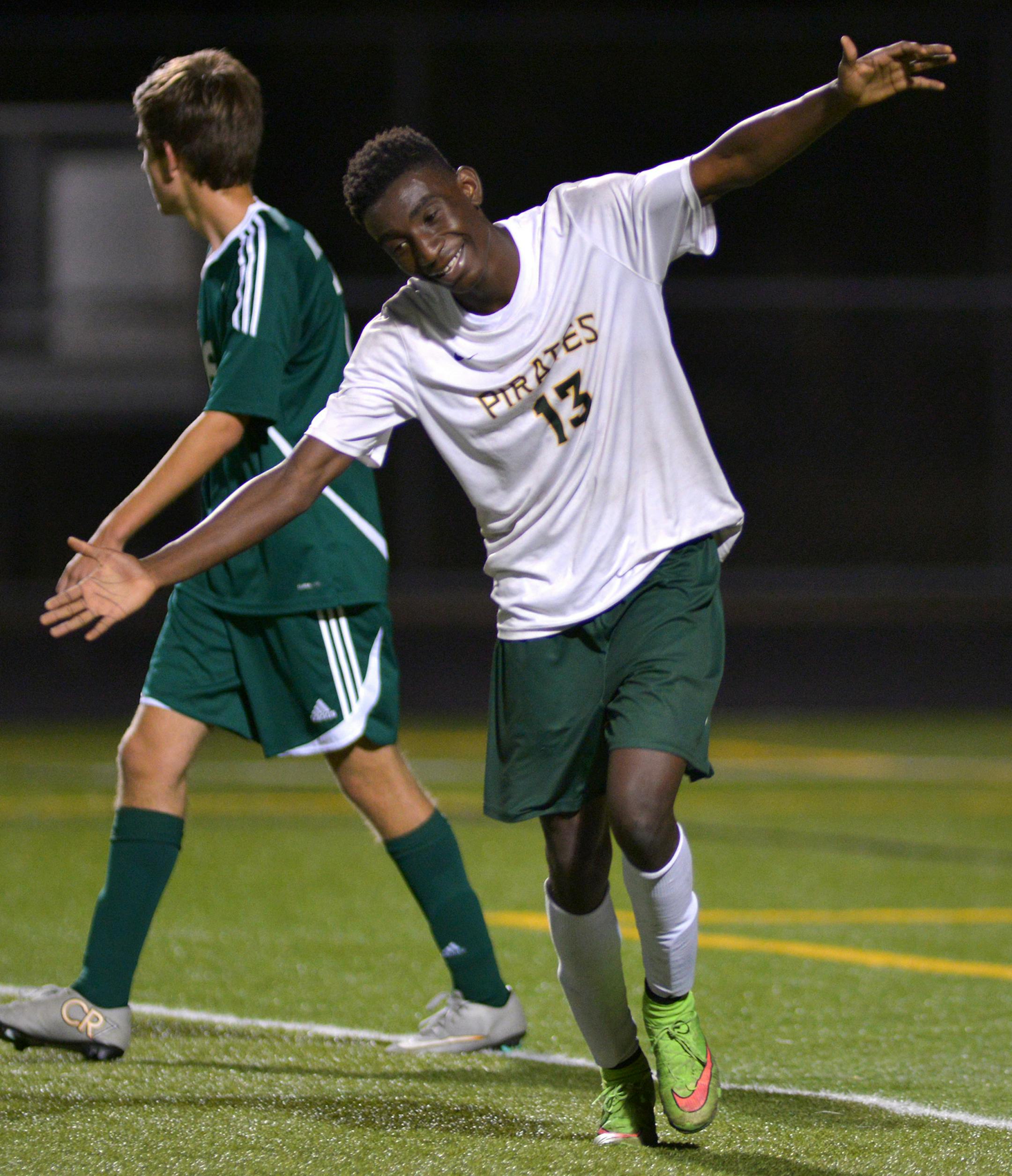 Park Center senior forward Sam Moses celebrates the Pirates 3-1 victory over Mounds View with seconds left in the Class 2A Section 5 boys' soccer tournament playoff game Tuesday night at Park Center High School in Brooklyn Park. Moses scored the first and third goals for the Pirates. ] (SPECIAL TO THE STAR TRIBUNE/BRE McGEE) **Sam Moses (white, 13)
