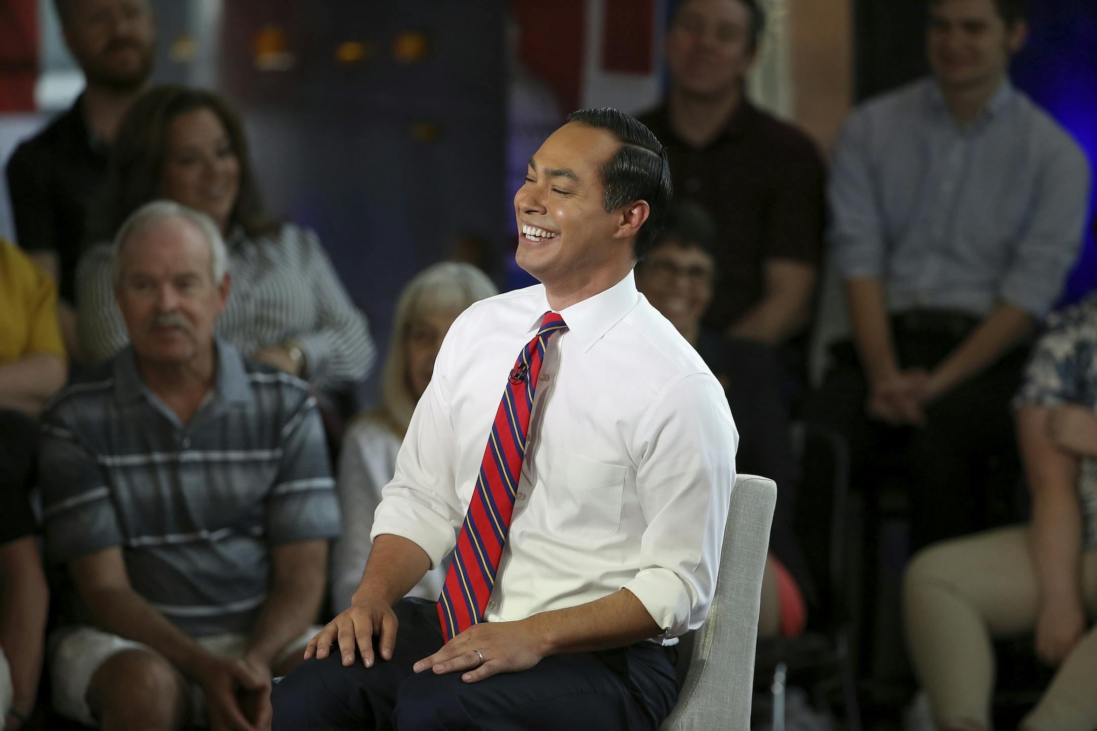 Democratic presidential candidate Julian Castro laughs along with the audience during a FOX News Channel town hall event, Thursday, June 13, 2019, in Tempe, Ariz. (AP Photo/Ross D. Franklin)