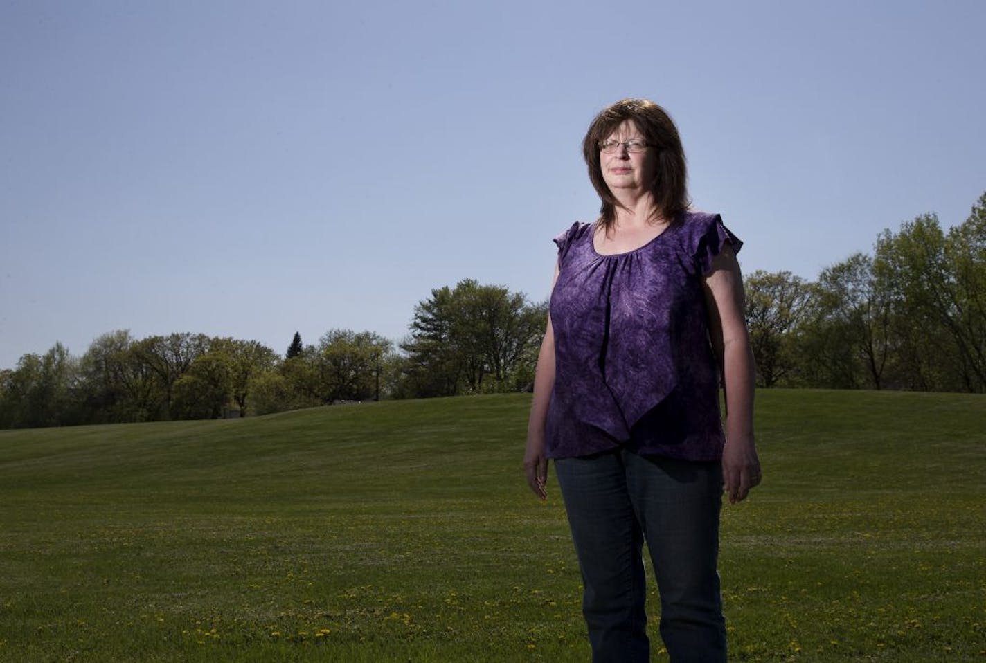 Barb Waller photographed at the former site of the Reilly creosote plant in St. Louis Park.