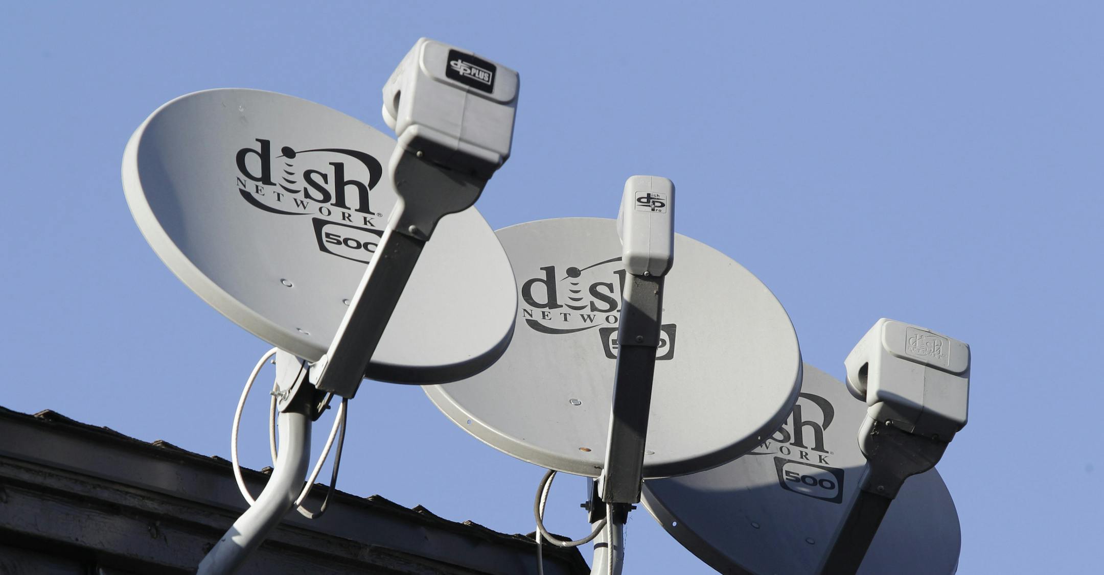 FILE - Three Dish Network satellite dishes are shown at an apartment complex in Palo Alto, Calif., in this Feb. 23, 2011 file photo. Dish Network is offering to buy Sprint Nextel Corp. in a cash-and-stock deal it values at $25.5 billion, saying its bid is superior to that of Japanese phone company SoftBank. (AP Photo/Paul Sakuma, File) ORG XMIT: MIN2013042214444253