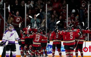 The Frost's Sophie Jacques skates away as Ottawa players celebrate Emily Clark's goal during overtime in Game 1 of the PWHL Finals on Tuesday in Ottaw