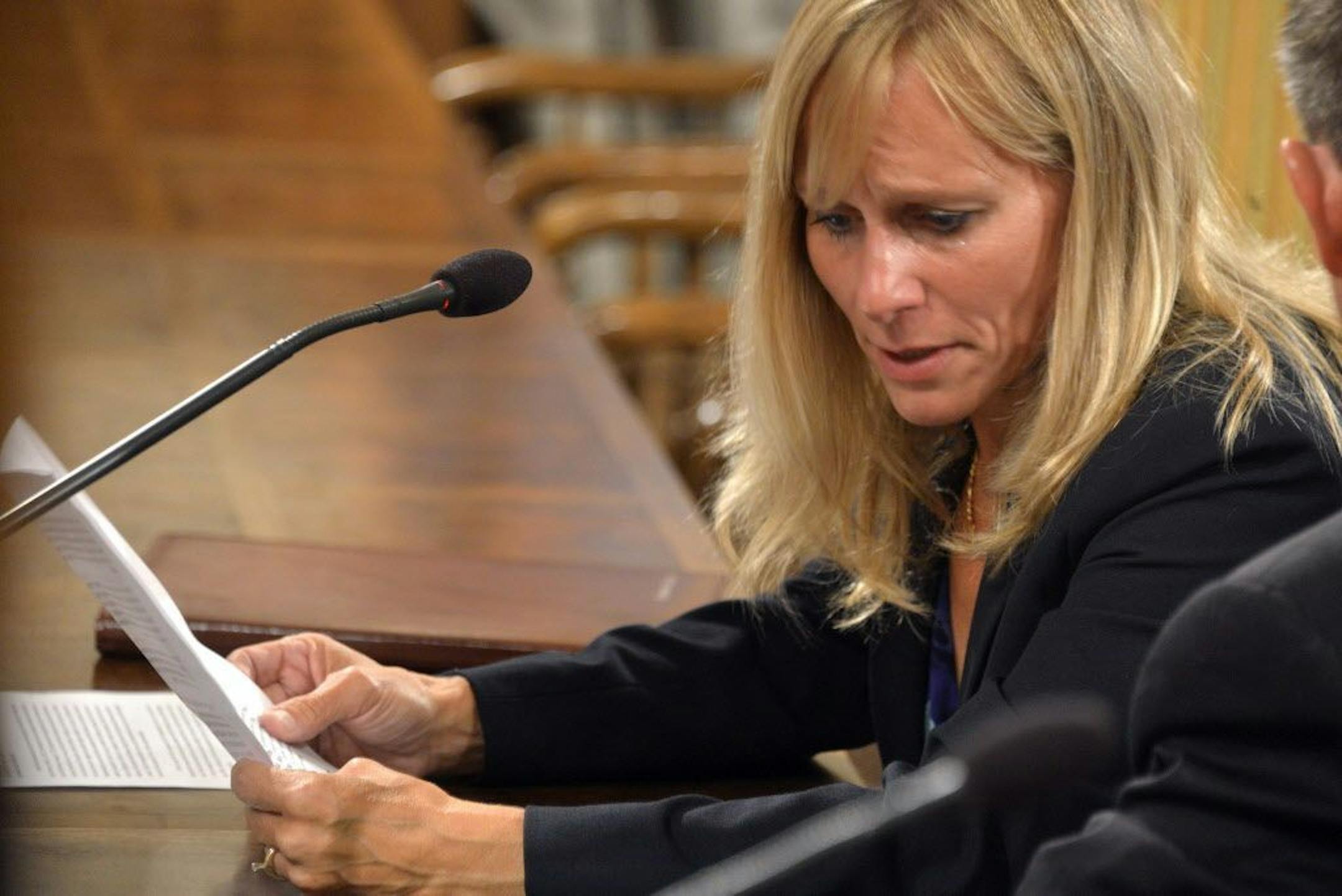 State Rep. Cindy Gamrat, R-Plainwell, tears-up as she reads one of two apologies at a legislative hearing in the House Appropriations committee room, Tuesday, Sept 8, 2015, in Lansing, Mich. The top lawyer for the Michigan House recommended Tuesday, that Rep. Todd Courser be expelled and Gamrat censured for misconduct stemming from an attempt to hide their extramarital affair. (Dale G. Young/Detroit News via AP) DETROIT FREE PRESS OUT; HUFFINGTON POST OUT; MANDATORY CREDIT
