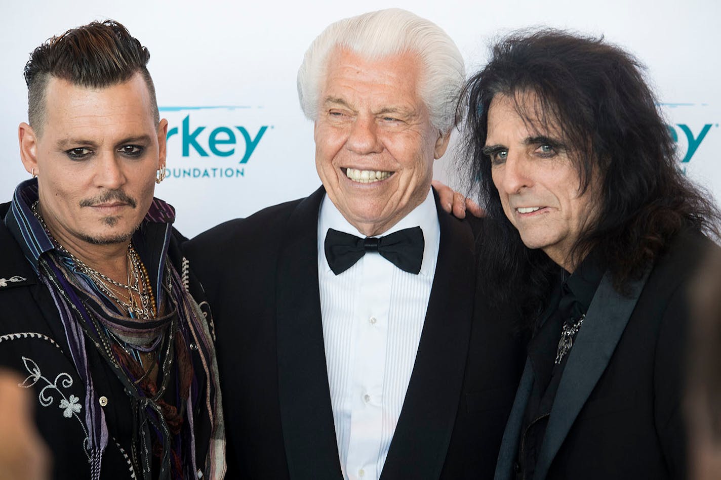 Starkey Labs owner Bill Austin was flanked by actor Johnny Depp and rocker Alice Cooper at a Starkey Hearing Foundation event in 2016 at the River Centre in St. Paul.