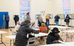 Voters fill out their ballots on Nov. 8 at Emerson Dual Language School in Minneapolis.