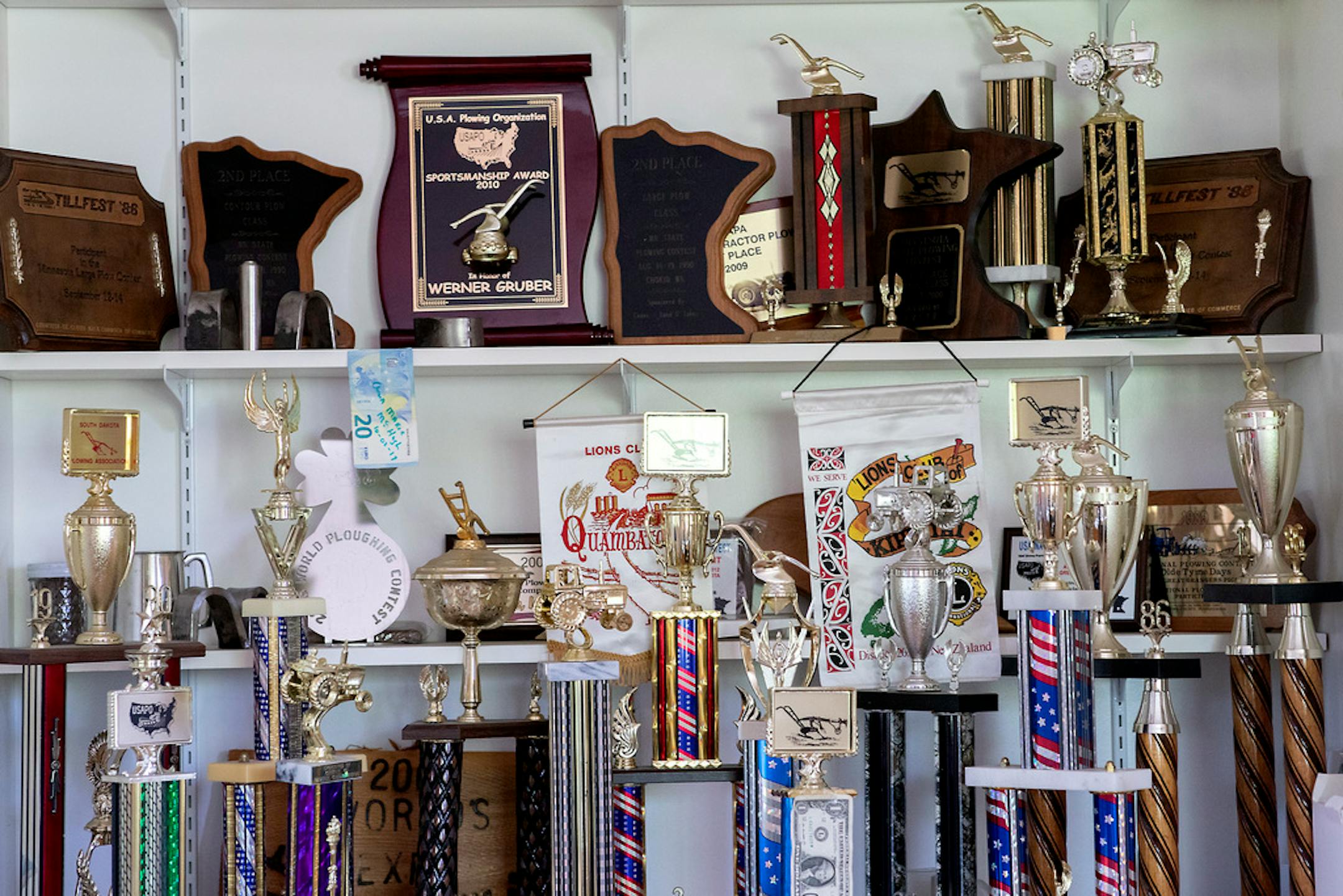 Gene Gruber's trophy case in his office in Richmond, Minn. He has won eight U.S. championships. "It's a personal challenge to try to get your plow to do things it typically won't do," he said.