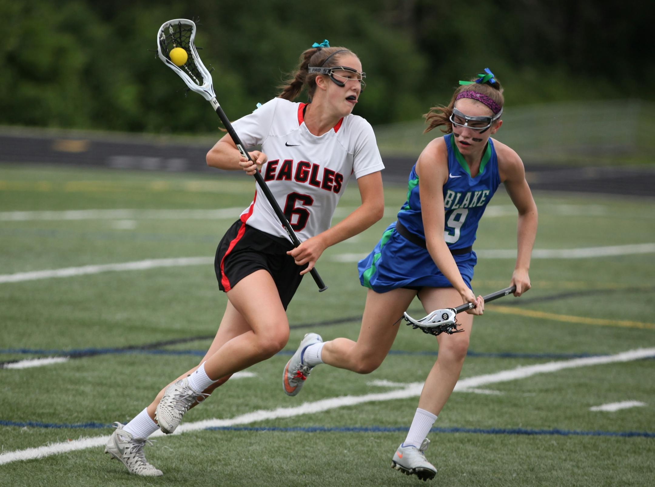 Eden Prairie CJ Froemming (6) and The Blake School Shannon Ellis (19) chased the ball during a game last season.