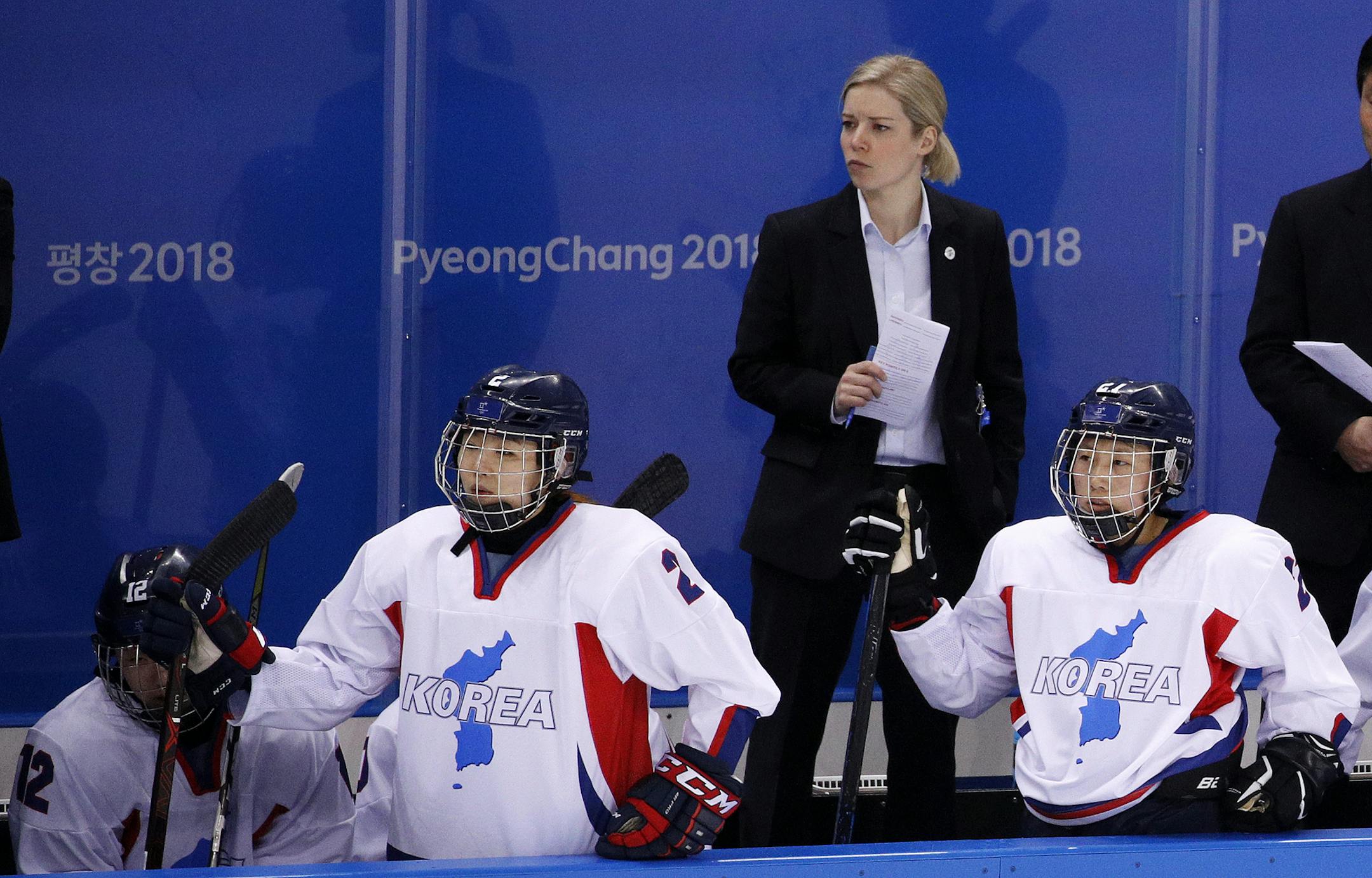 Head coach Sarah Ruth Murray, of the combined Koreas team, watches during the second period of the preliminary round of the women's hockey game against Switzerland at the 2018 Winter Olympics in Gangneung, South Korea, Saturday, Feb. 10, 2018. (AP Photo/Jae C. Hong)