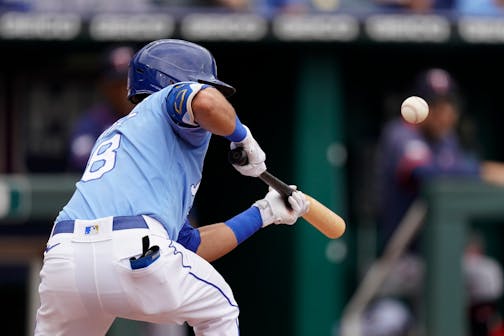 Kansas City Royals' Nicky Lopez bunts into a triple play during the third inning of a baseball game against the Minnesota Twins Sunday, June 6, 2021, in Kansas City, Mo. (AP Photo/Charlie Riedel)