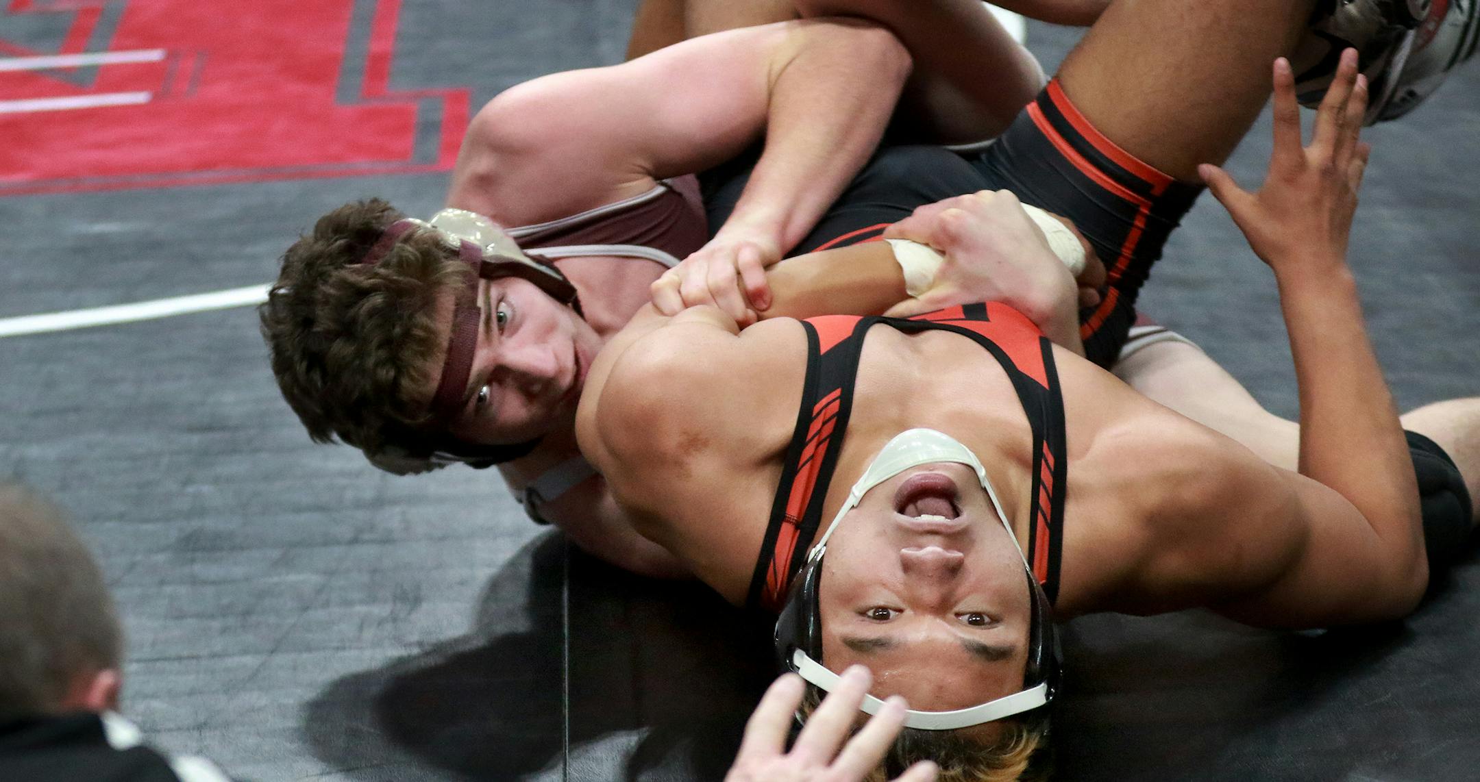 Ryan Duffy of South St. Paul attempts to pin Brandon Frisby of Grand Rapids during their 170 pound match of the Minnesota State High School League 2A wrestling quarterfinals Friday, March 3, 2016, at the Xcel Energy Center in St. Paul, MN. Duffy won later in the match by a pin.] DAVID JOLES ï david.joles@startribune.com MSHL state wrestling quarterfinals