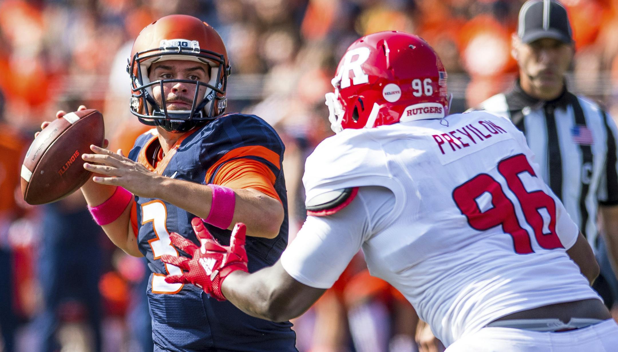 Illinois quarterback Jeff George Jr. (3) throws the ball while under pressure from Rutgers defensive lineman Willington Previlon (96) during the first quarter of an NCAA college football game Saturday, Oct. 14, 2017, at Memorial Stadium in Champaign, Ill. (AP Photo/Bradley Leeb)