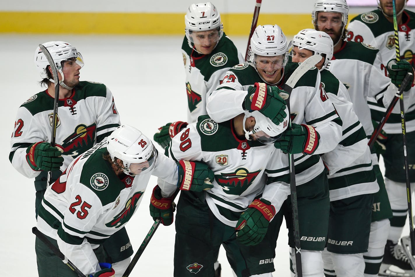 Wild players congratulate Marcus Johansson, front center, on his overtime goal against the Los Angeles Kings