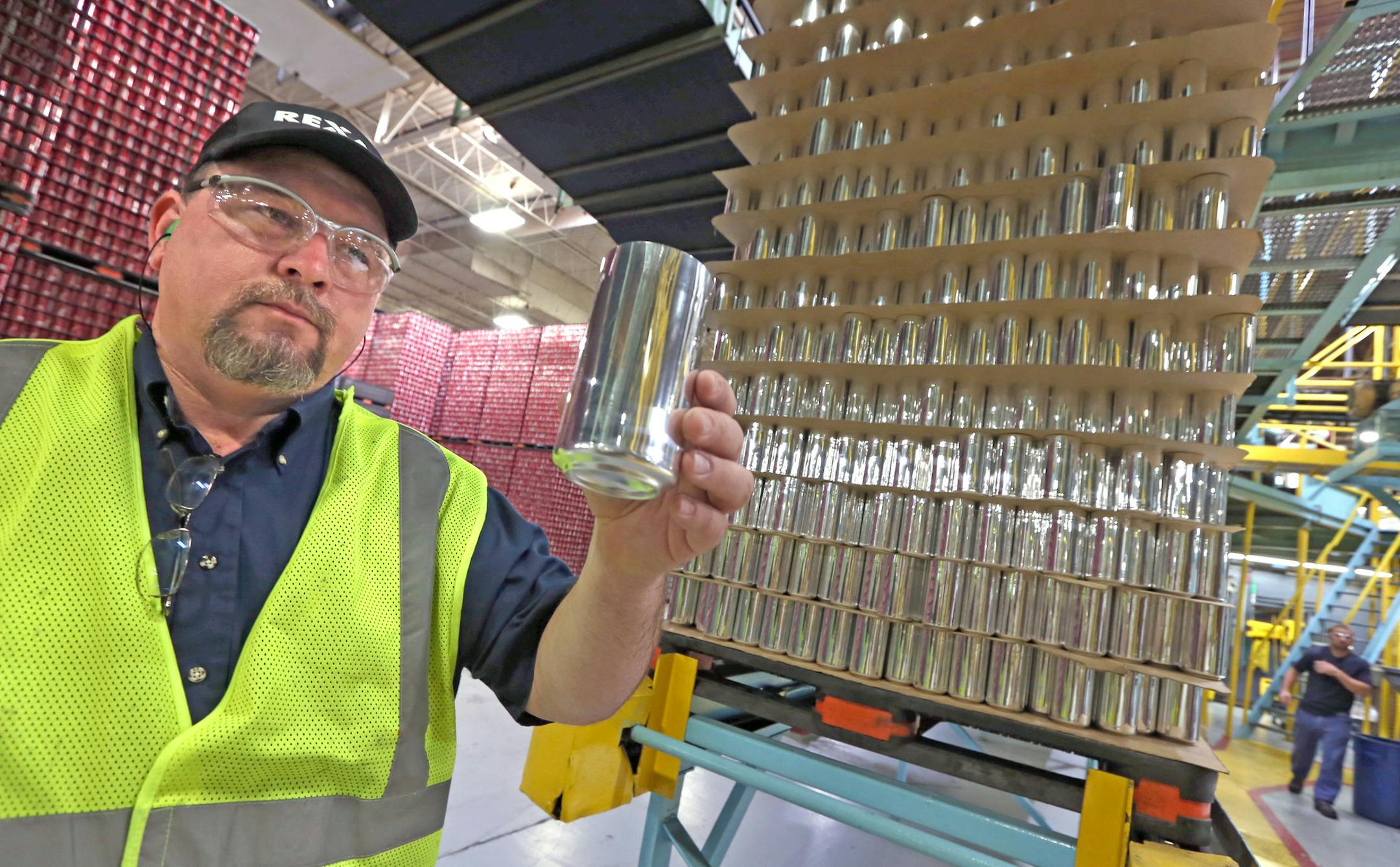 Chris Karpovich, Plant Manager at the Rexam Plant in St. Paul, held an aluminum can after it was formed and washed, just before it was painted for either Coke, Pepsi or other bottlers products on 8/8/13. Minnesotans only recycle 40% of all beer and soda cans. The nation recycles 58% of all cans. Yet the metal is easily recycled and increasingly going into cars and other items. Rexam Beverage Can Co. in St. Paul makes cans for Coke and Pepsi, etc and just made 1,200 cans for the state fair recycl