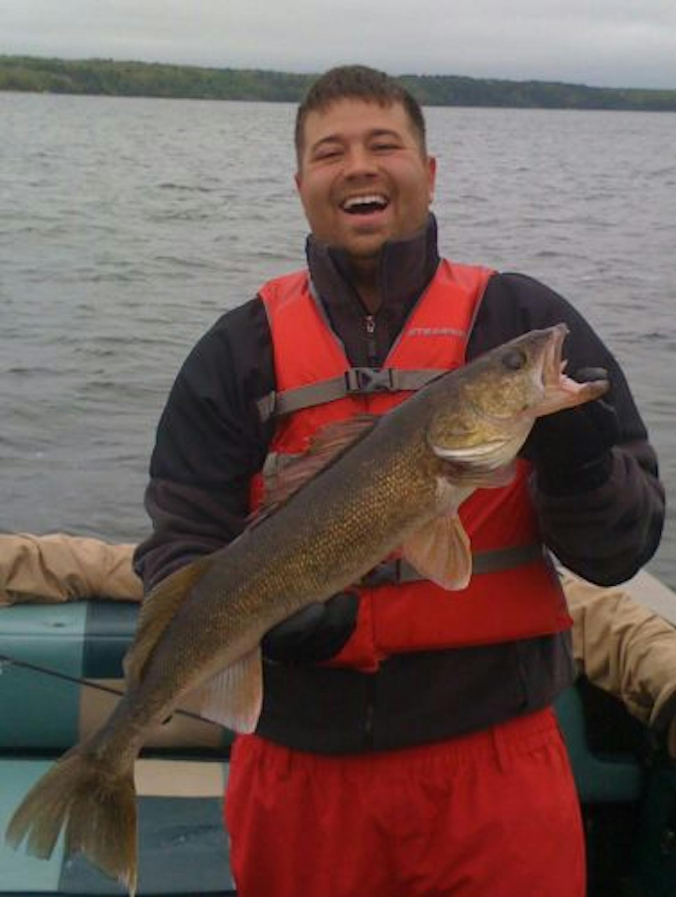Israel Moe of Walker, Minn., with a 31-inch walleye he caught in Leech Lake.