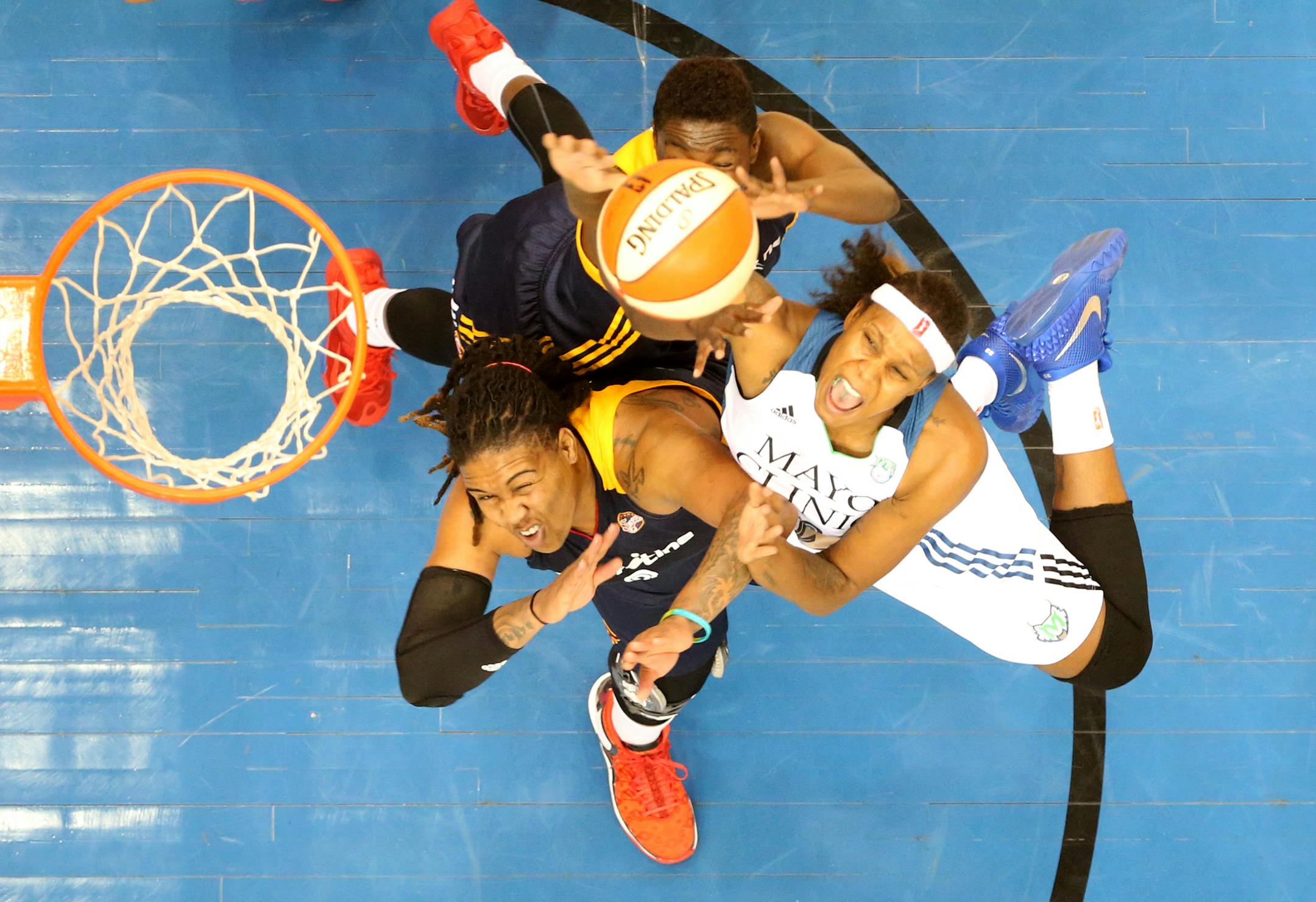 Minnesota Lynx forward Rebekkah Brunson (32) and Indiana Fever forward Erlana Larkins (2) fought for the ball during the second half. ] (KYNDELL HARKNESS/STAR TRIBUNE) kyndell.harkness@startribune.com Game 5 of the WNBA finals Lynx vs Indiana at the Target Center in Minneapolis, Min., Wednesday October 14, 2015.