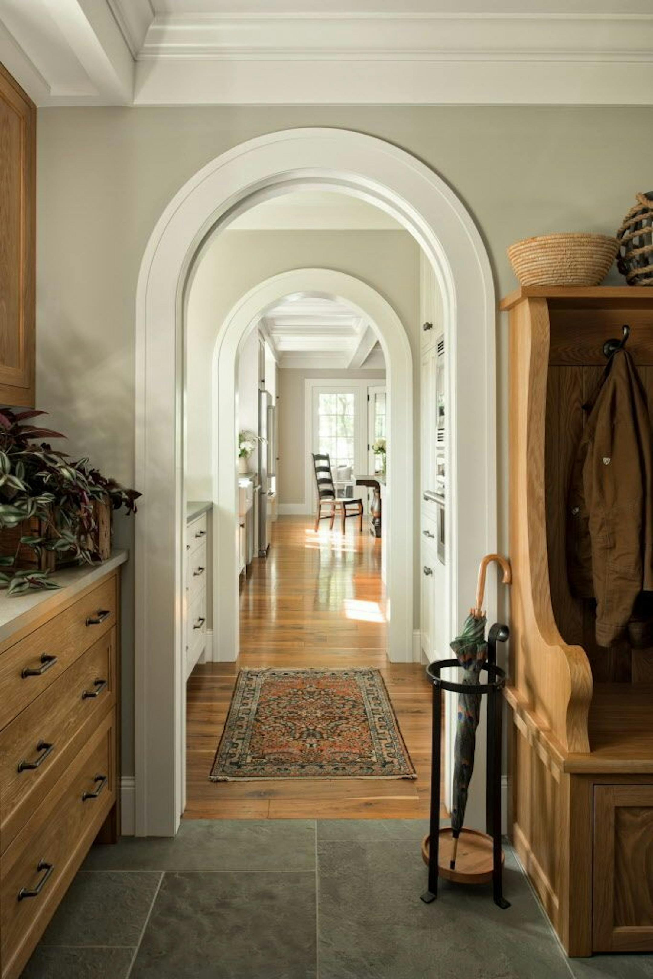 Archways connect rooms and create carefully framed views inside a Lake Superior retreat, by Mark Larson, Rehkamp LarsonArchitects.