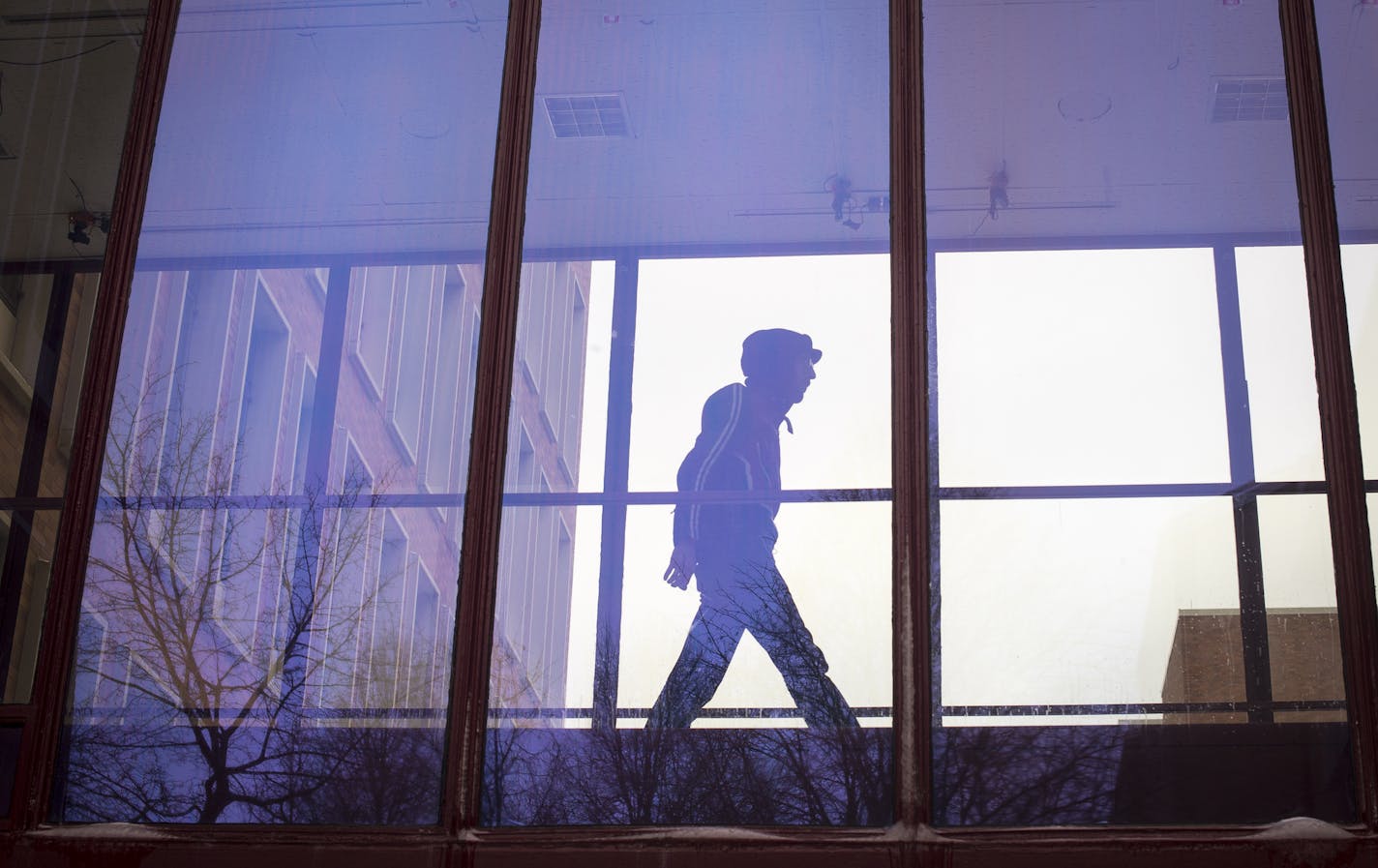 A man crossed a skyway connecting two classroom towers on the U&#x2019;s West Bank campus on Wednesday. The windows have a blue UV film to deter birds from colliding with the glass.