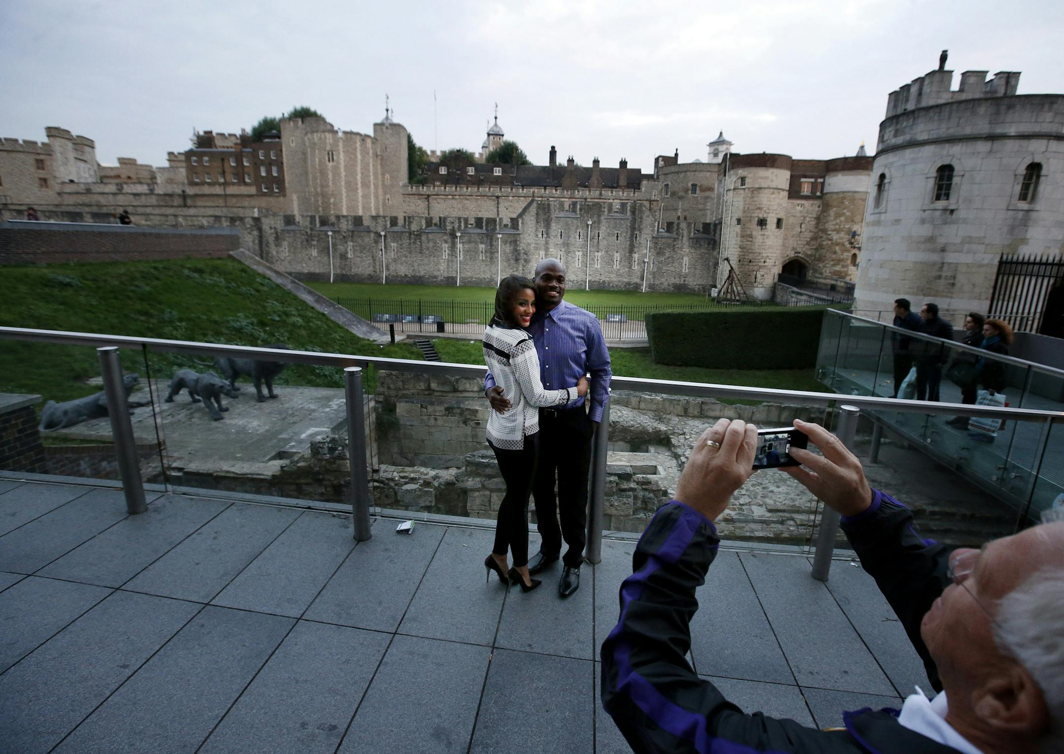 Minnesota Vikings running back Adrian Peterson posed for a picture with his fiance Ashley Brown in front of The Tower of London. The Minnesota Vikings attended a private event at The Tower of London on Friday evening. ] CARLOS GONZALEZ cgonzalez@startribune.com September 27, 2013, London, England (Minnesota Vikings in London) Vikings visit The Tower of London