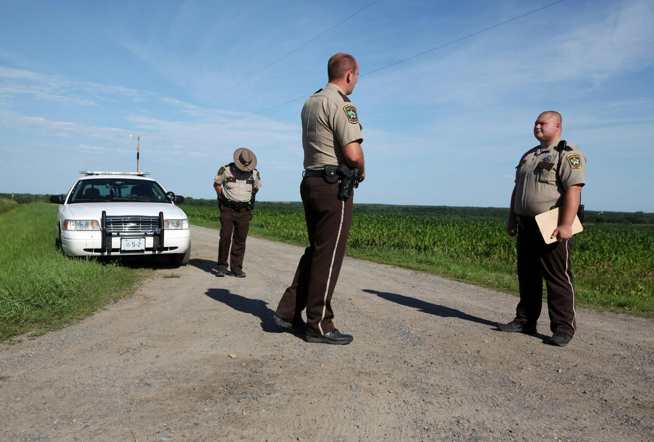Deputies stood guard at a St. Joseph, Minn., farm that was being investigated Wednesday.
