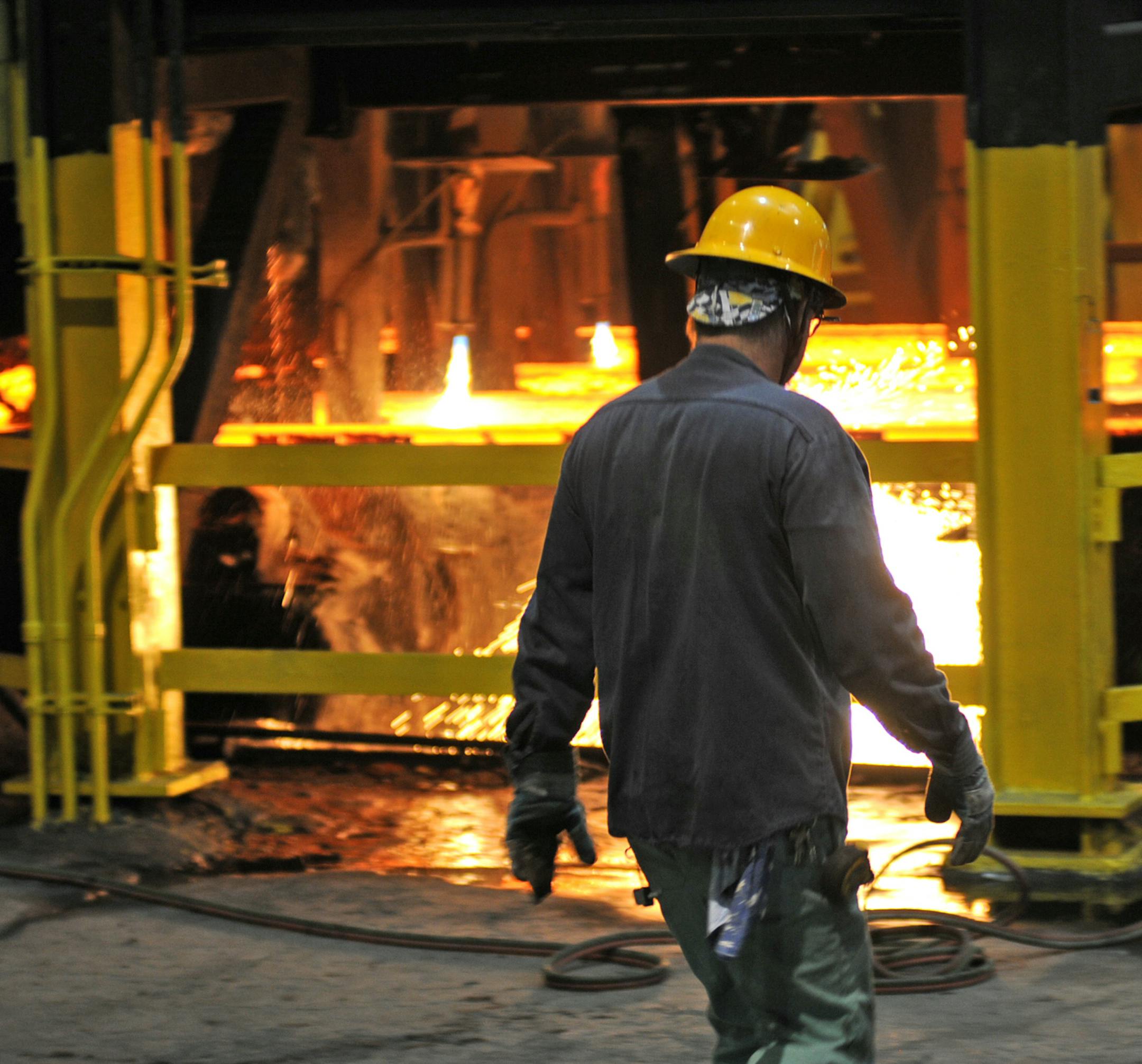 Gerdau is a St. Paul steel mill that makes steel from crushed cars and scrap metal.This is an area where steel is cast into billets. This steel worker walked by the area where the billets are cut. ] Richard.Sennott@startribune.com Richard Sennott /Star Tribune. , St Paul Mn. Wednesday 05/30/12) ** (cq)