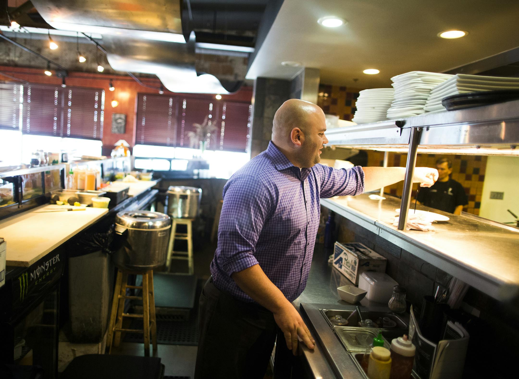 Manager Phil Werner did some work in the kitchen at Shanghai Bistro in Stillwater, MN on September 5, 2014, in Stillwater, Minn. Werner finds most the Shanghai Bistro employees prefer to work at the Stillwater location rather than the Hudson, Wis. Shanghai Bistro because the minimum wage is higher and the menu prices are higher which equals more tips. ] RENEE JONES SCHNEIDER • reneejones@startribune.com