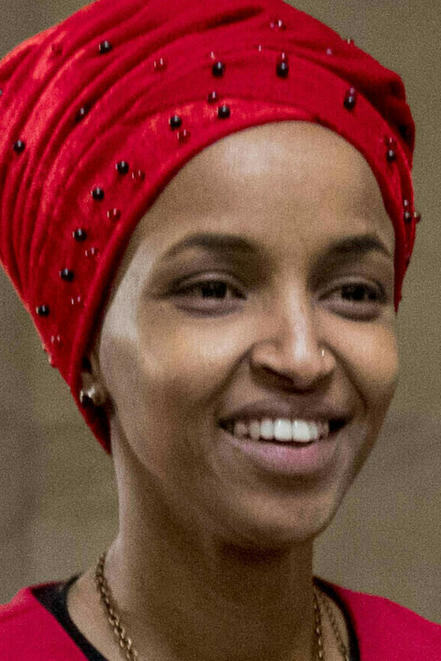 In this Jan. 16, 2019 file photo, Rep. Ilhan Omar, D-Minn., center, walks through the halls of the Capitol Building in Washington. (AP Photo/Andrew Harnik)