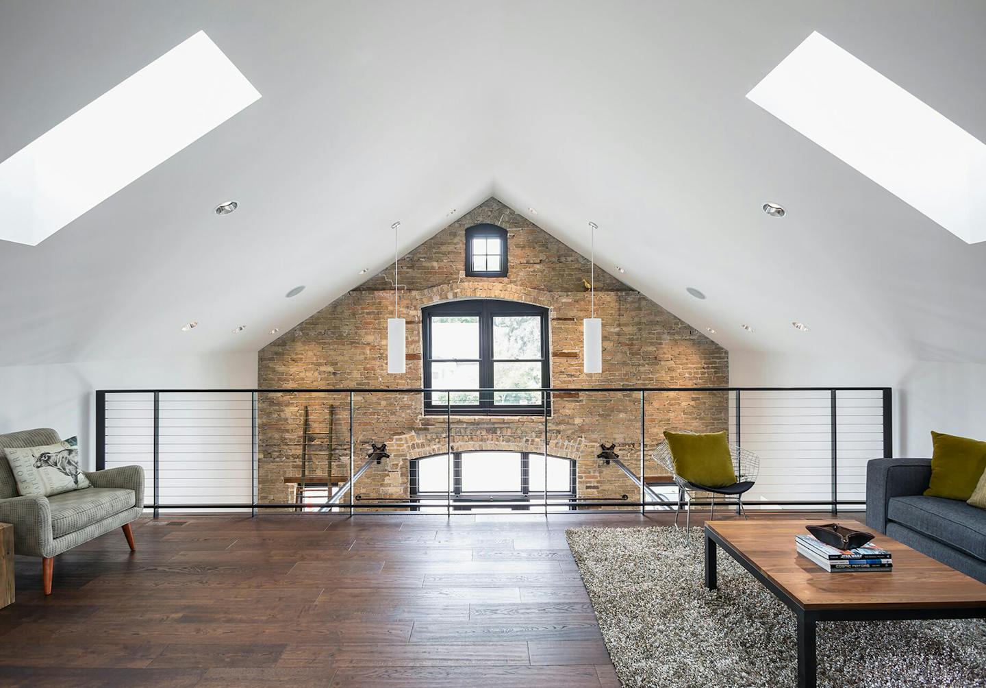 The lofted sitting area overlooks the main room and entrance.