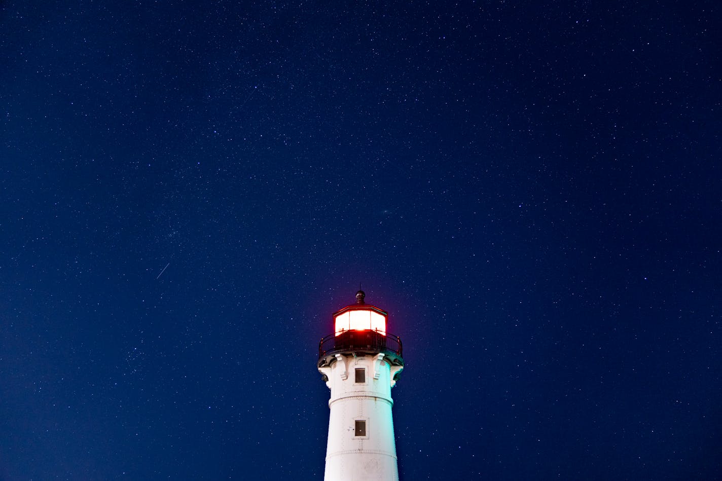 Faint stars are visible over the Duluth Harbor North Breakwater Lighthouse despite light pollution Tuesday, Sep. 27, 2022 in Duluth, Minn.   ]