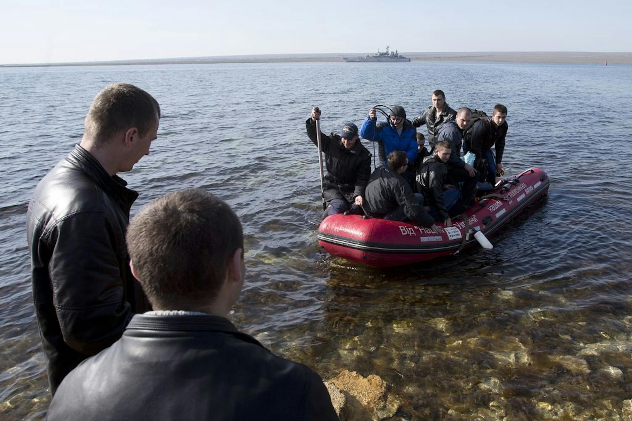 Ukrainian sailors leave the Konstantin Olshansky navy ship in the bay of Donuzlav, Crimea, Monday, March 24, 2014. Ukraine's fledgling government ordered troops to retreat from Crimea on Monday.