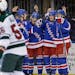 New York Rangers center J.T. Miller (10), second from right, celebrates his goal with teammates during the second period of the NHL hockey game agains