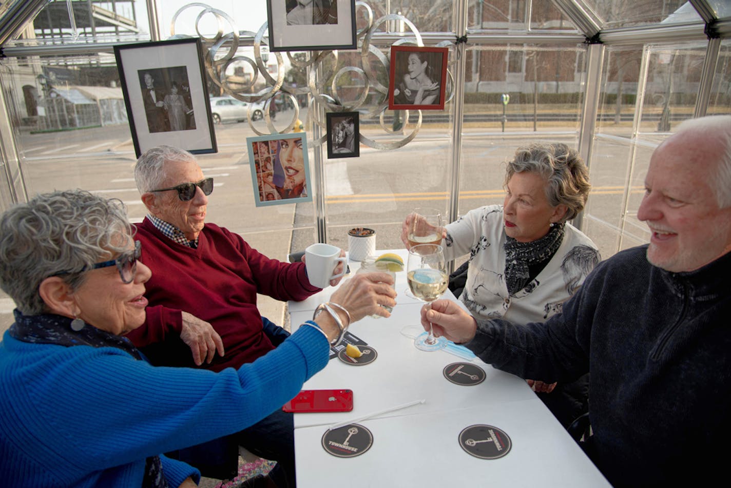 Phyllis and Sheldon Schwartz, left, toast with longtime friends Randy and Rochelle Forester while dining out in downtown Detroit, March 16, 2021. Older Americans still make up a majority of those who have been inoculated against the coronavirus, and many are taking advantage and venturing out. (Cydni Elledge/The New York Times)