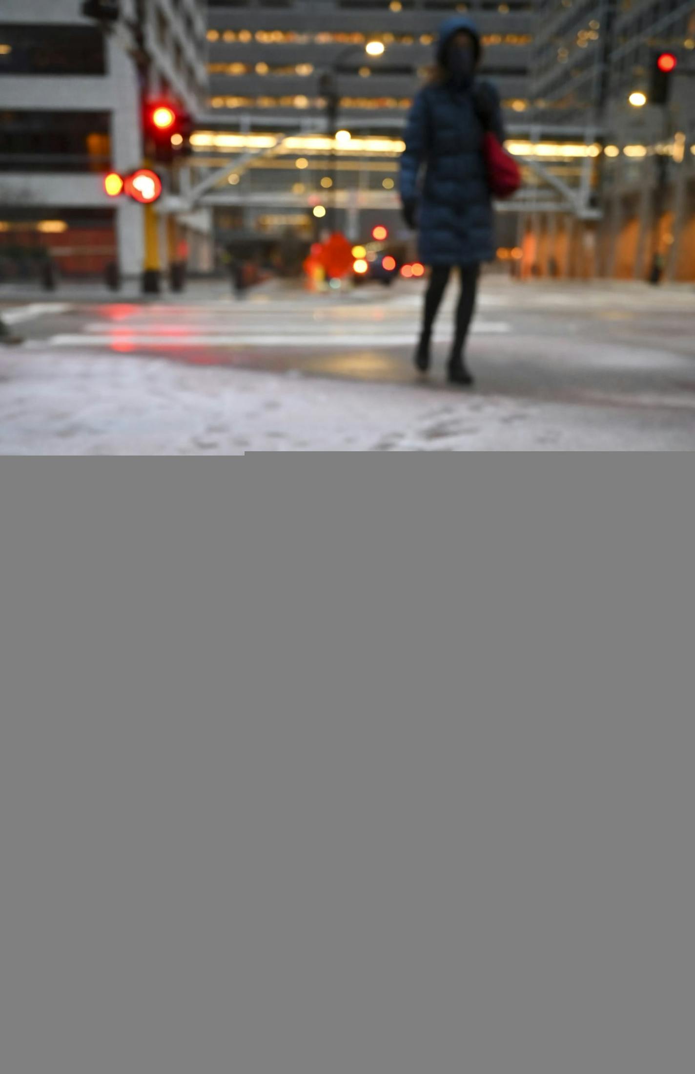 A mixture of ice and snow covered the sidewalk along 6th Street South in downtown Minneapolis Tuesday evening. ] AARON LAVINSKY • aaron.lavinsky@startribune.com A snowstorm hit downtown Minneapolis during rush hour on Tuesday, Nov. 10, 2020.