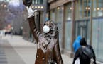 The Mary Tyler Moore statue on Nicollet Mall got a mask and rubber glove, perhaps for levity in the face of the Coronavirus, and seen Wednesday, April