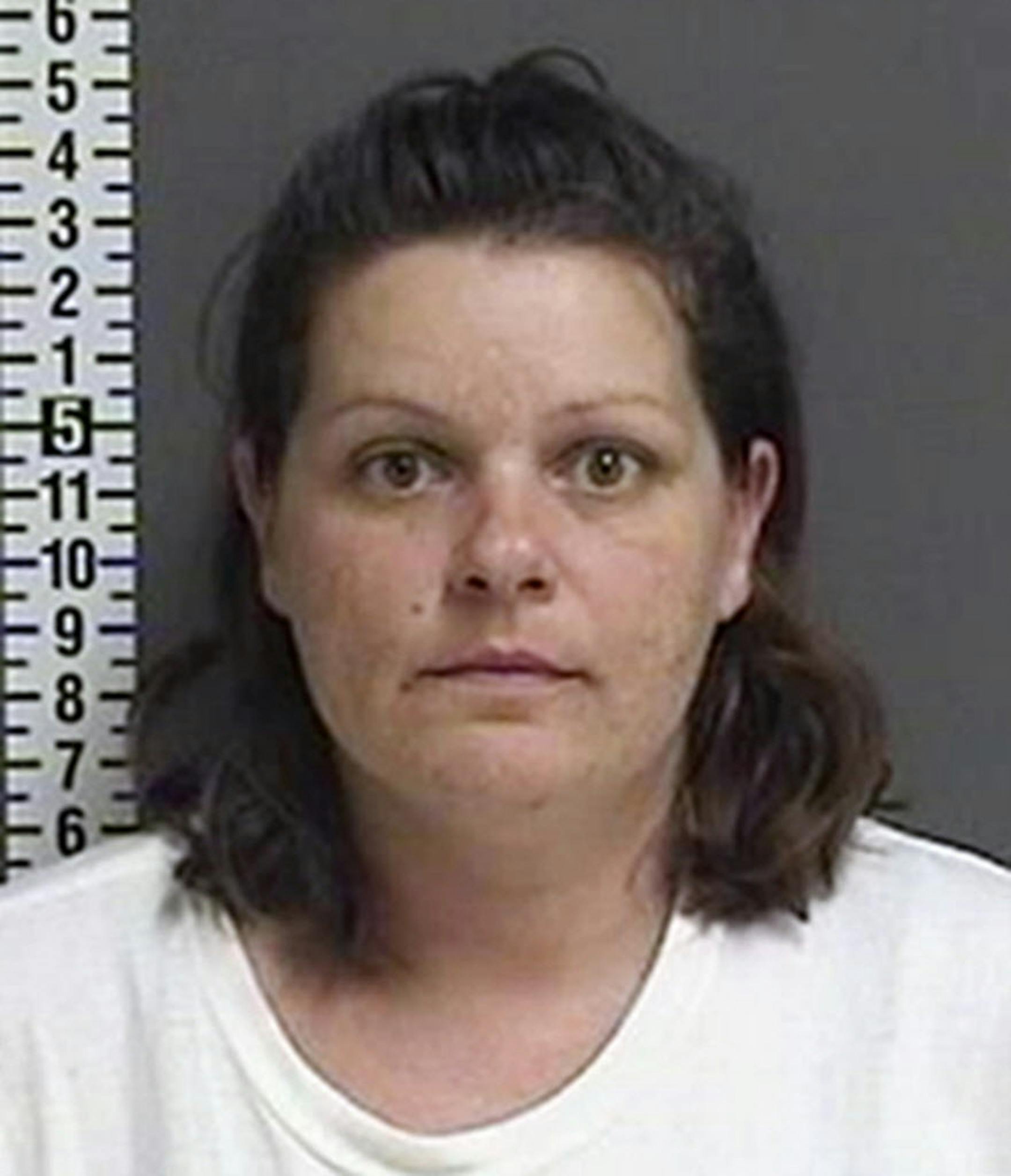 FILE - This August 2017, file photo provided by the Cass County Sheriff's Office in Fargo, N.D., shows Brooke Crews, one of two suspects charged with conspiracy to commit murder and other counts, in connection with the death of pregnant Savanna Greywind in North Dakota. Crews intends to change her not-guilty plea. A hearing is set for Dec. 11, 2017. (Cass County Sheriff's Office via AP, File)