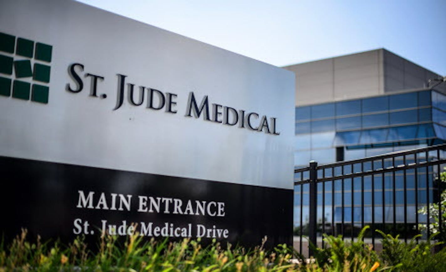 This Wednesday, July 22, 2015, photo shows St. Jude Medical corporate headquarters, in Little Canada, Minn., just north of St. Paul. Abbott Laboratories will spend $19.3 billion to buy St. Jude Medical Inc. in a cash-stock deal that aims to strengthen the medical device maker's stake in cardiovascular care, the companies announced Thursday, April 28, 2016. The combined company will offer devices in nearly every area of cardiovascular care, competing directly with industry leaders Medtronic Inc.