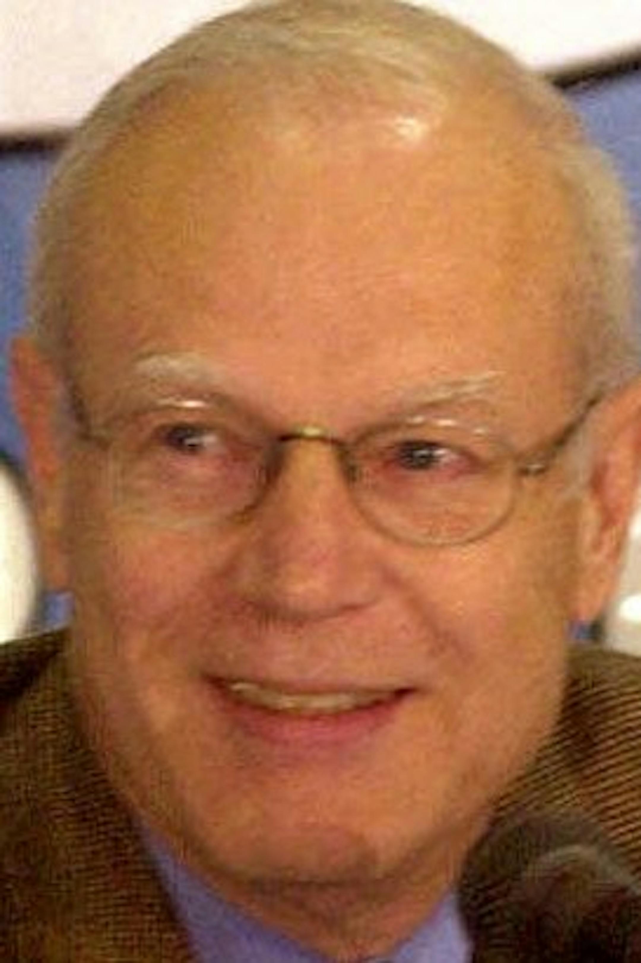 FILE - In this June 30, 2000, file photo, North Carolina basketball coach Bill Guthridge smiles as he announces his retirement during a news conference in Chapel Hill, N.C. Bill Guthridge, the longtime assistant to Dean Smith who succeeded him as North Carolina's head coach, has died. He was 77. The school announced Wednesday that Guthridge died Tuesday night, May 12, 2015. (AP Photo/Grant Halverson)