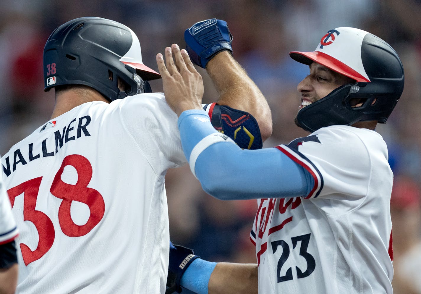 Matt Wallner (38) of the Minnesota Twins is greeted by Royce Lewis (23) after hitting a grand slam homerun in the sixth inning Tuesday, August 15, 2023, Target Field in Minneapolis, Minn. ] CARLOS GONZALEZ • carlos.gonzalez@startribune.com