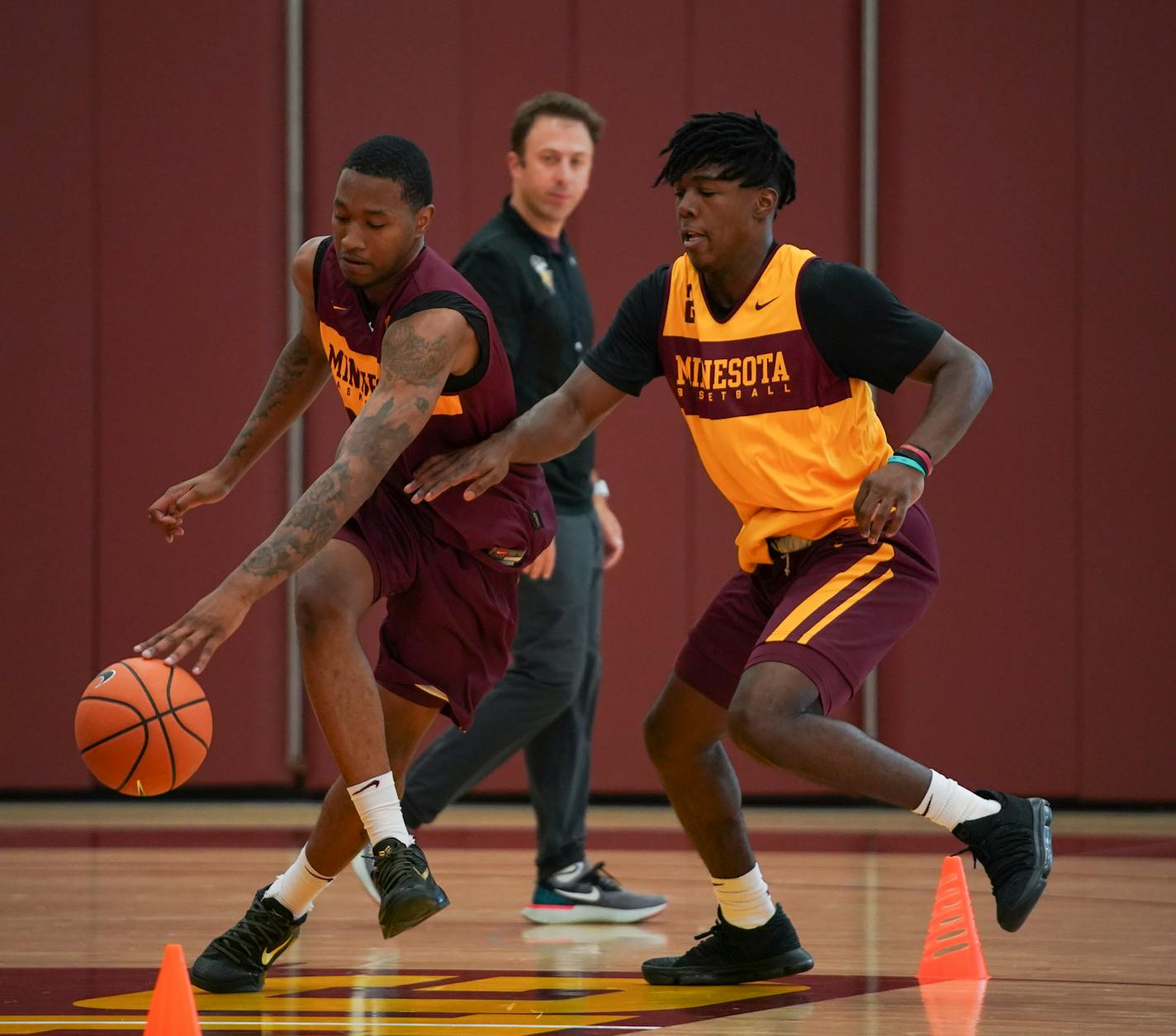 Dupree McBrayer, left, and Marcus Carr took part in a drill during an early practice. Carr is yet to be cleared by the NCAA.