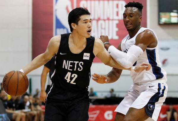 Brooklyn Nets' Yuta Watanabe (42) drives around Minnesota Timberwolves' Josh Okogie during the first half of an NBA summer league basketball game, Mon