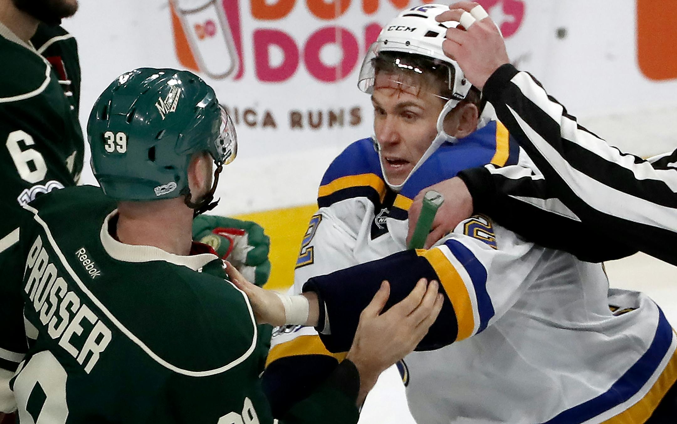 Nate Prosser (39) tangled up with Jori Lehtera (12) in the second period.
