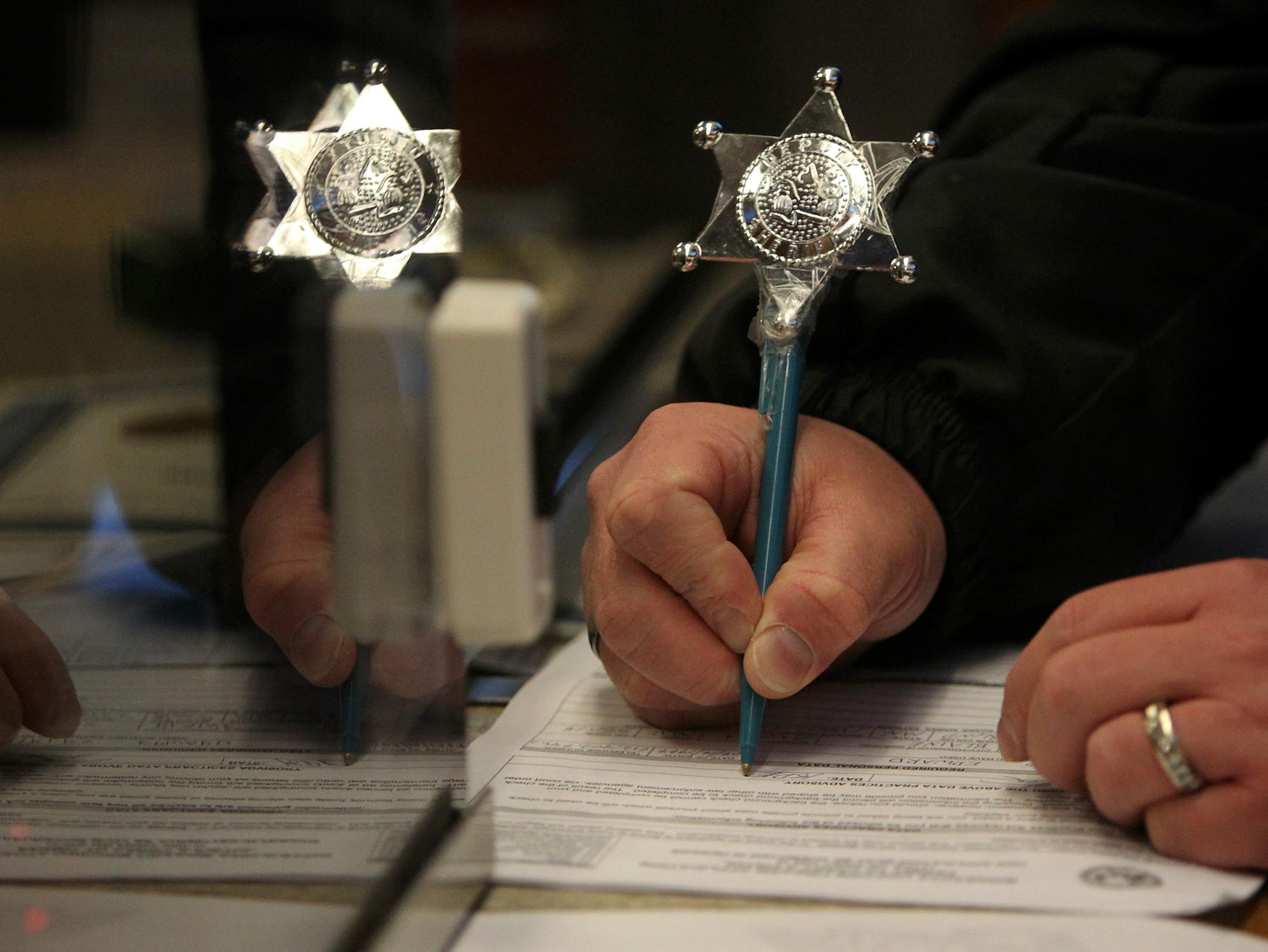 Dec. 18, 2012: A man who would give only his first name of Charles filled out the paperwork for a handgun permit to carry at the Anoka County Sheriff's Office in Andover.