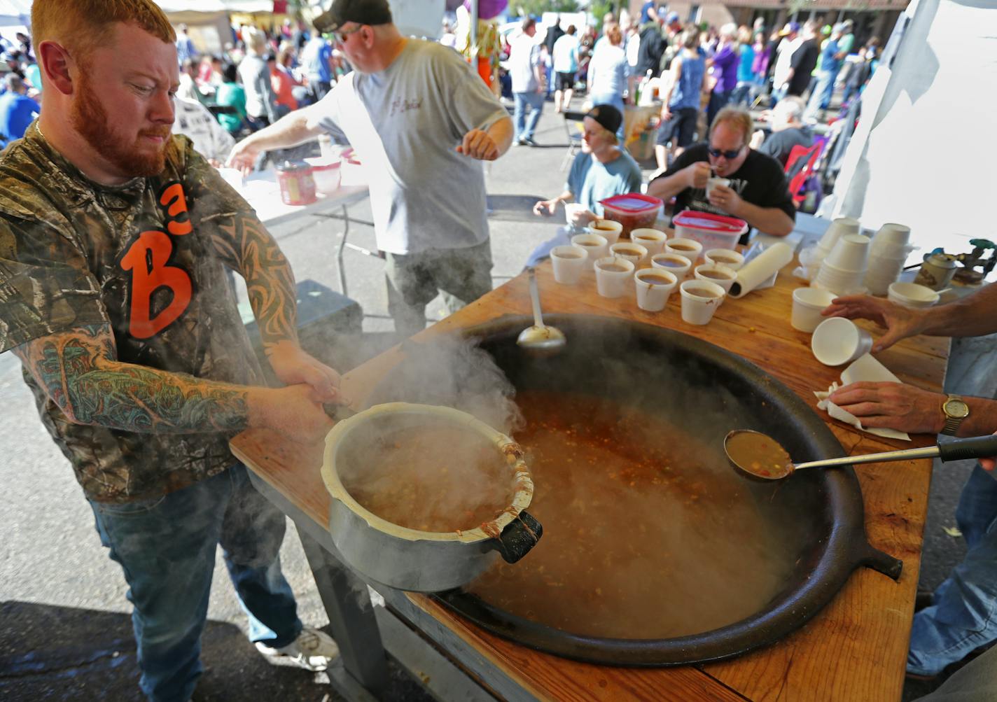 Ron Kuehl transfered a pot of booya while working in the Big Boy Booya tent in South St. Paul. ] South St. Paul has been hosting a fall booya event since 1982, drawing in 7,000 to 10,000 attendees. The celebration was started by South St. Paul native and local character Walter Books, who has since enlisted friends to help out. SHARI L. GROSS / sgross@startribune.com