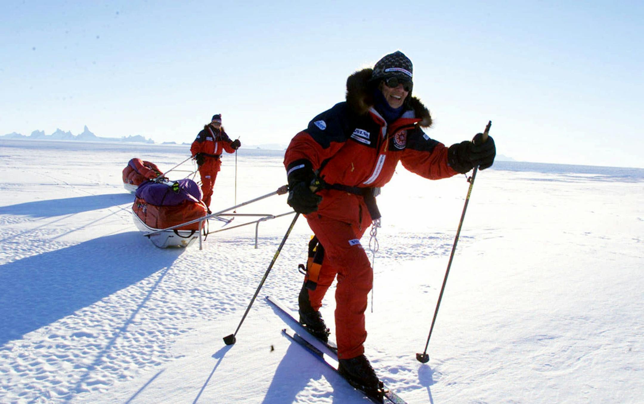 Ann Bancroft of Scania, Minn., leads her partner Liv Arnesen of Norway, as they test their 250-pound (113 kilogram) sled in Blue One, Antarctica Monday Nov. 13, 2000. Bancroft and Arnesen are scheduled to set off Tuesday as they attempt to become the first women to ski unaided across the frozen continent of Antarctica. (AP Photo/Obed Zilwa) ORG XMIT: MER17cc2b3a743989b80496543565372