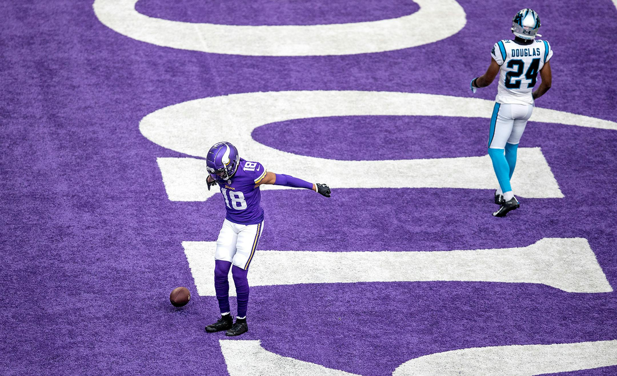 Minnesota Vikings wide receiver Justin Jefferson (18) celebrated his 12 yard first quarter touchdown over Carolina Panthers cornerback Rasul Douglas (24).