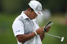 Hideki Matsuyama looked at score card on the 16 green during third round action at TPC Twin Cities Saturday July,6 2019 in Blaine, MN. ] Jerry Holt &#