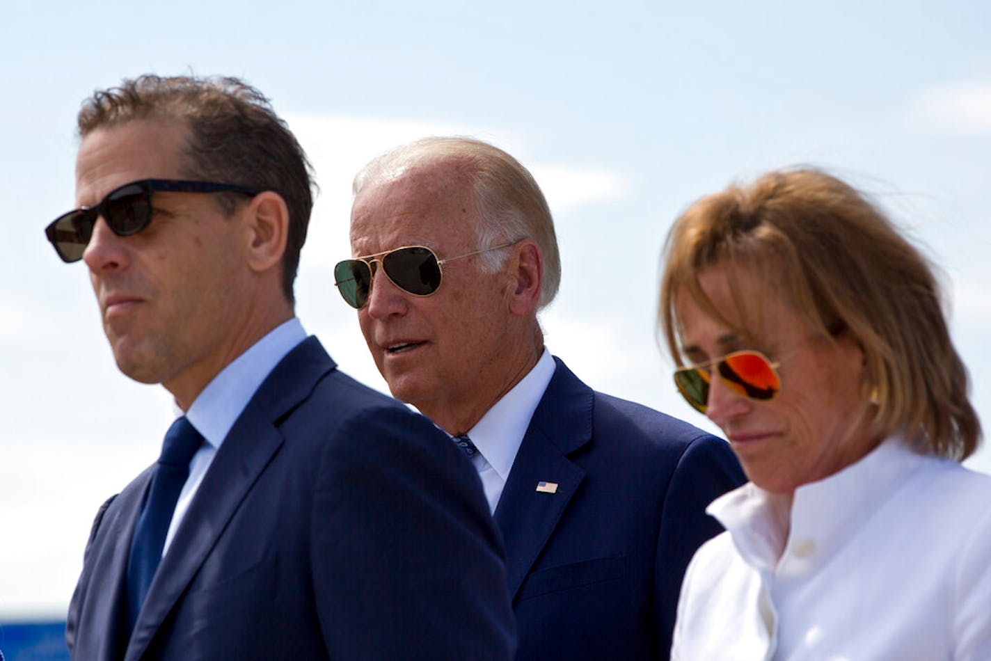 Family members gather for a road naming ceremony with U.S. Vice President Joe Biden, centre, his son Hunter Biden, left, and his sister Valerie Biden Owens, right, joined by other family members during a ceremony to name a national road after his late son Joseph R. "Beau" Biden III, in the village of Sojevo, Kosovo, on Wednesday, Aug. 17, 2016. President Joe Biden is the guest of honor during the street dedication ceremony naming the national road Joseph R. "Beau" Biden III.AP Photo/Visar Kryeziu)