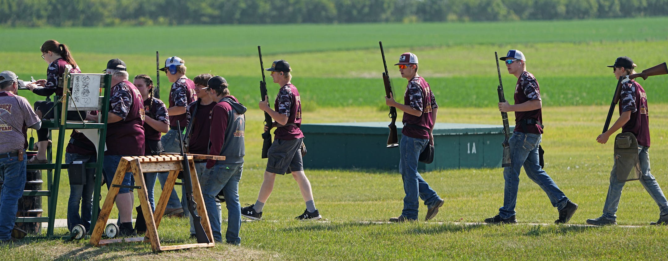Members of the Blackduck High School Trap Team enter the range to compete during the State Championship event. The Minnesota State High School Trap Shooting Championships are the largest trap shooting competition in the country — reflective of how Minnesota has cultivated competitive shooting's rise as a high-school sport. Tuesday, June 13, 2023 in Alexandria, Minn. ] Brian Peterson ¥ brian.peterson@startribune.com