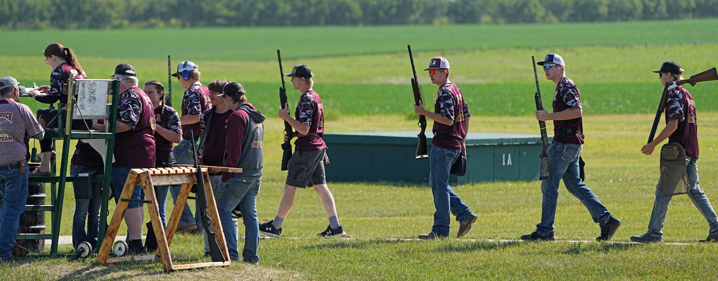 Members of the Blackduck High School Trap Team enter the range to compete during the State Championship event. The Minnesota State High School Trap Shooting Championships are the largest trap shooting competition in the country — reflective of how Minnesota has cultivated competitive shooting's rise as a high-school sport. Tuesday, June 13, 2023 in Alexandria, Minn. ] Brian Peterson ¥ brian.peterson@startribune.com