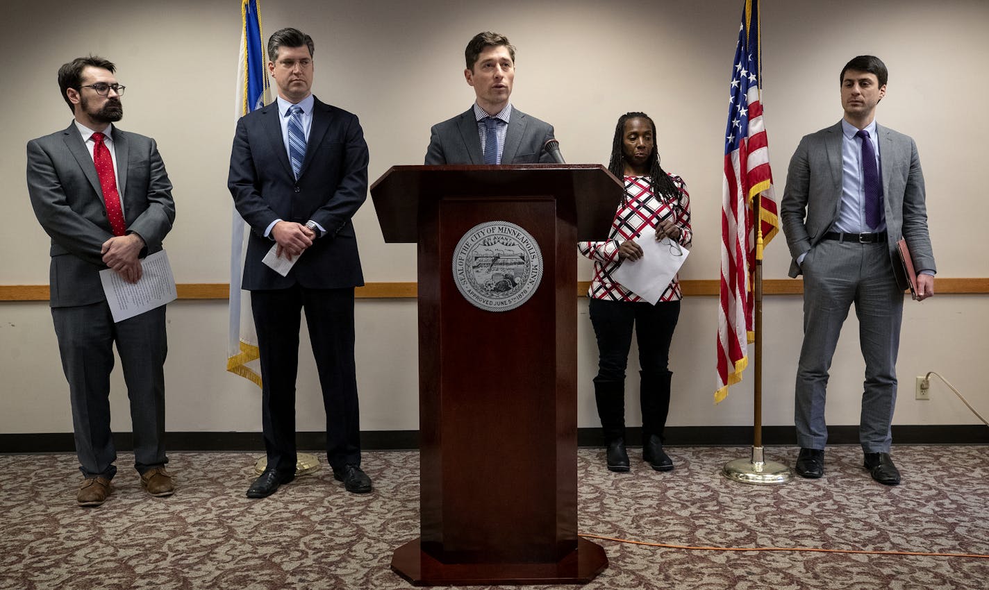 Minneapolis Mayor Jacob Frey along with attorneys Tom Walsh, Clint Conner, Luke Grundman (far right) and resident Gina Robinson (right of mayor) during a press conference at City Hall. Robinson spoke about her personal experience and not having the benefits legal representation. Mayor Frey and a coalition of lawyers announced a program that seeks to help residents facing evictions in court ] CARLOS GONZALEZ &#xef; cgonzalez@startribune.com &#xf1; November 14, 2018, Minneapolis, MN, City Hall, Ma