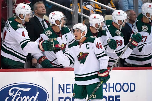 Minnesota Wild's Jared Spurgeon (46) returns to the bench after scoring during the second period of an NHL hockey game against the Pittsburgh Penguins in Pittsburgh, Saturday, Nov. 6, 2021. (AP Photo/Gene J. Puskar)